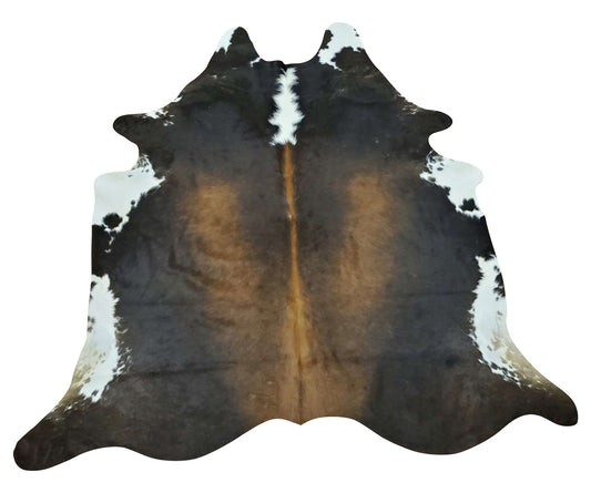 This dark rustic brown cowhide rug will be a great addition to your eclectic foyer it will add a little edge to balance the decor.