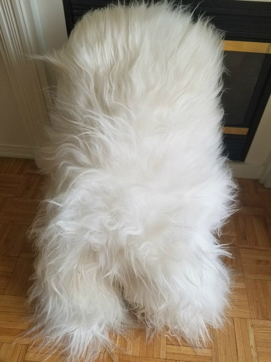 A one and only natural white sheep fur rug, it's genuine, thick, soft and fluffy and comes with so many natural benefits, lastly ethically sourced.
