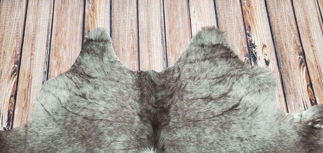 Bring warmth and style to your home with this brown white large long hair cowhide rug in Canada, perfect for any space, winter decor, or entryway. Shop now for the perfect accent piece!