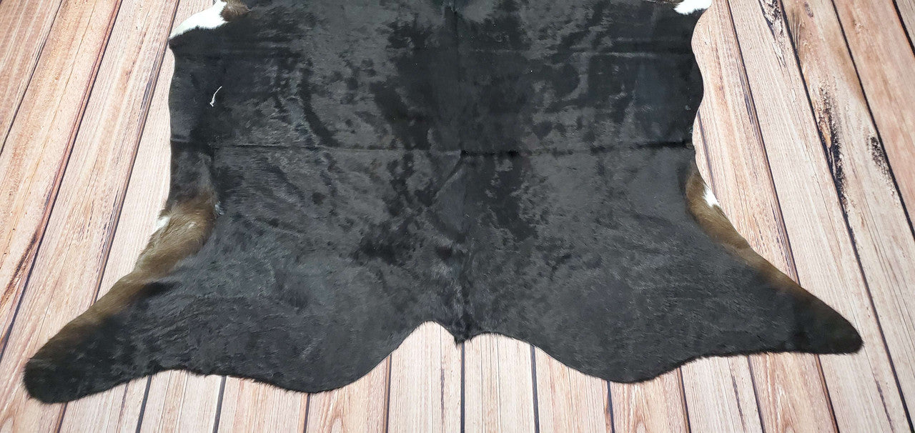 A unique and natural black cowhide rug is the perfect addition to any interior, it also add texture, style and a touch of rustic charm to any room.