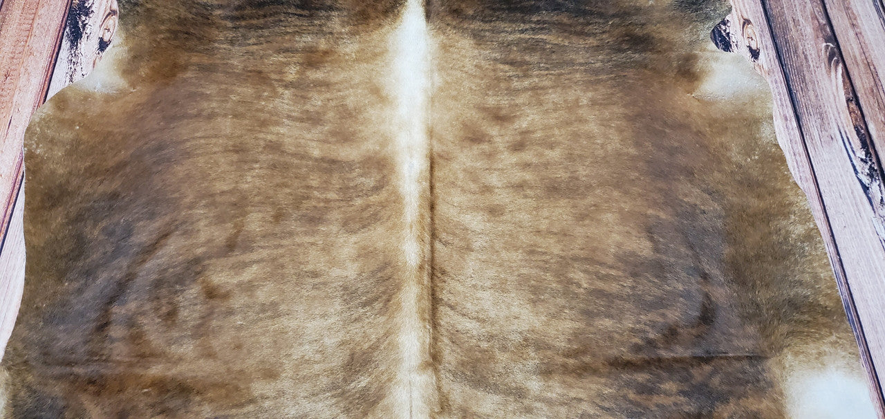 Large brown cowhide rugs can be hung on the wall, used as upholstery or even placed on floors in larger living spaces for a truly one-of-a-kind look. The natural texture of the cowhides is incredibly soft, giving it an elegant and timeless feel that will last for years to come.