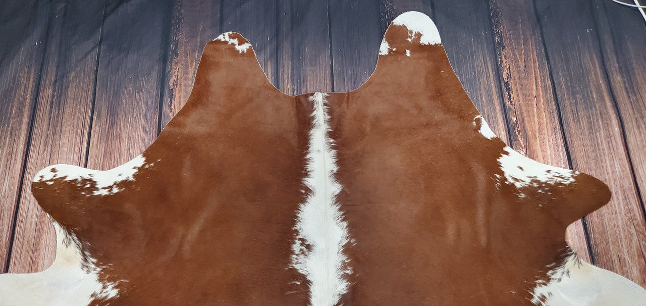 Give your home a rustic, western farmhouse charm with these authentic and natural cowhide rugs featuring classic Hereford style. Perfect for adding a cozy feel to any room!