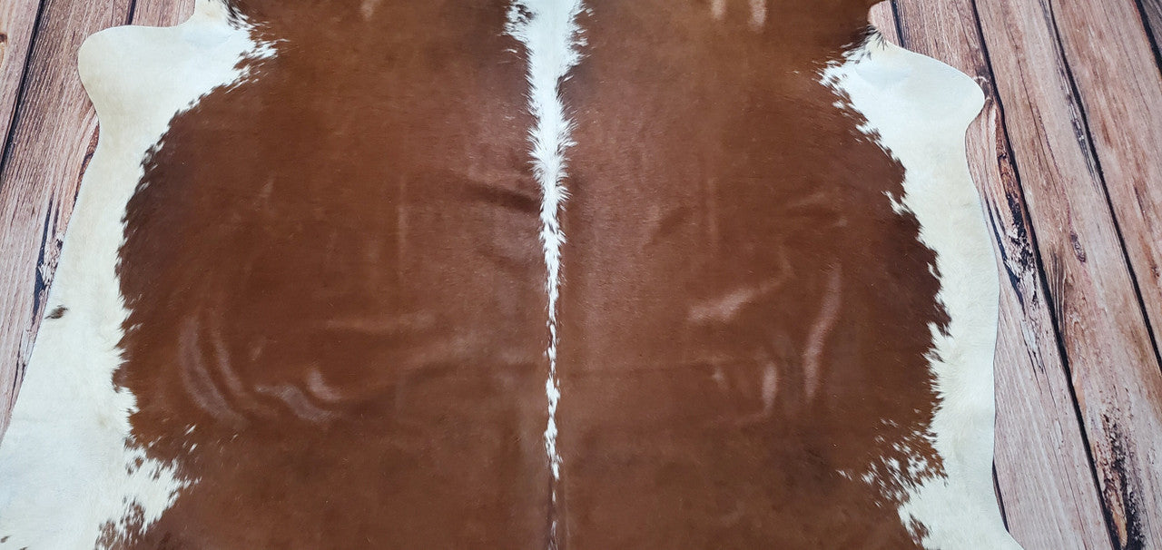 Add a touch of Brazilian charm to your home with these authentic and natural cowhide rugs in Hereford patterns.