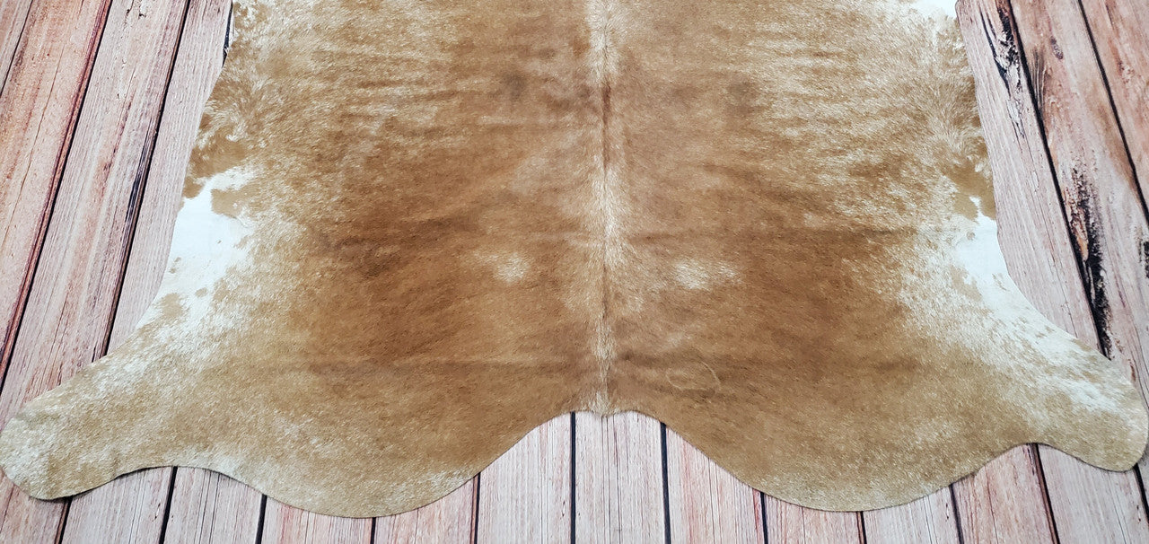 A beige brindle cowhide rug is a great way to add style and sophistication to any interior or home. This stunning rug is individually selected for its unique color palette.