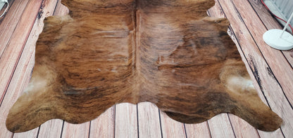 The natural texture of cowhide carpet provides a cozy atmosphere in any space, making it the ideal addition for an entryway or hallway rug. Furthermore, cowhide rugs can be used around the fireplace as well; the heat-resistant material ensures that your rug won't catch fire when exposed to extreme temperatures. 
