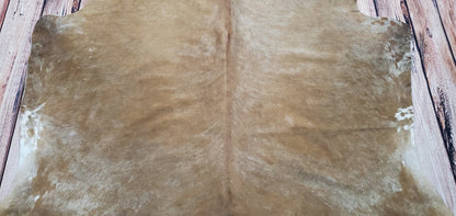 Decor Hut’s beige cowhide rugs make it easy to find one that fits perfectly with your style. Not only can these carpets add texture and colour to any space they are also incredibly practical; they are easy to clean and extremely hardwearing which makes them suitable for high traffic areas like living rooms or hallways. 