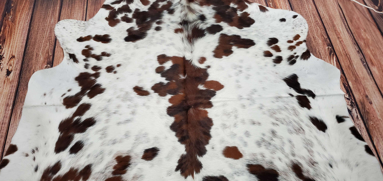 If you are planning to buy a salt and pepper cowhide rug look no further, this tricolor is one of a kind and a great choice for any living room