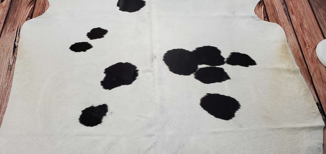 I’m so happy I chose the black and white cowhide rug ! Looks super cute and feels great. Vacuums well,