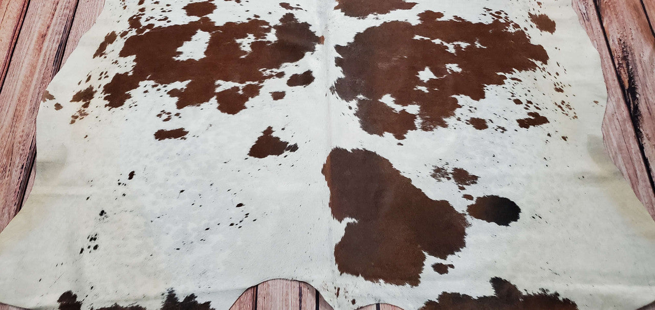 You will be super super happy with this cowhide rug. It's plush and has great colors with vibrant brown and white which makes the living room vintage and cozy.