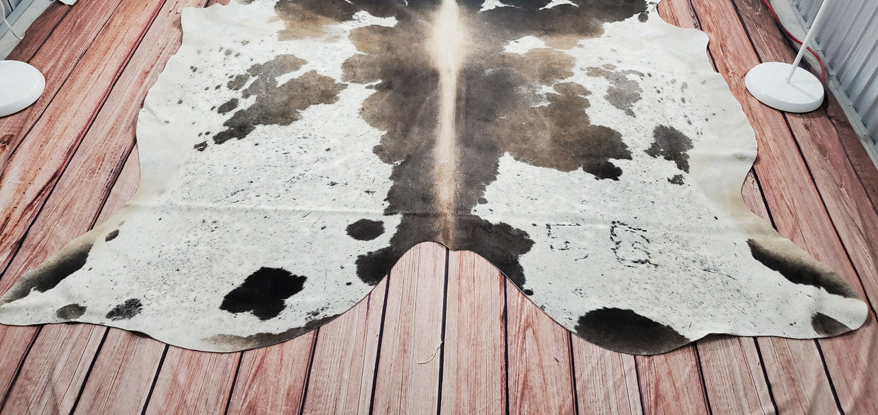 Enhance your space with a luxurious grey tricolor cowhide rug.