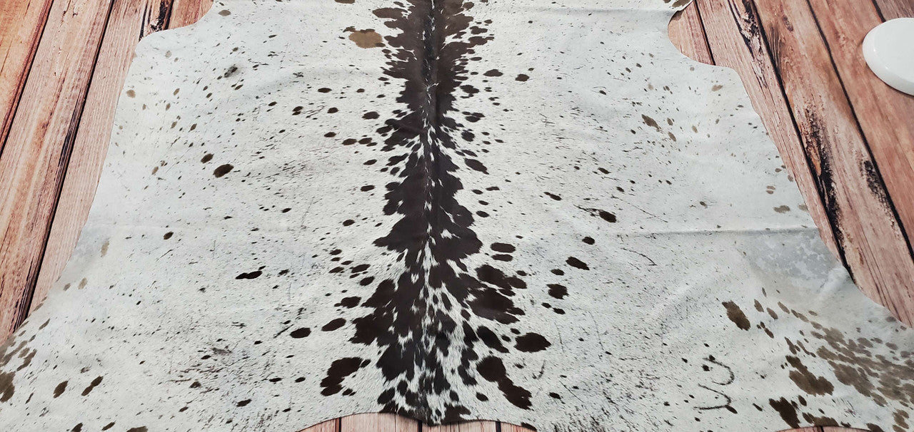 Brazilian cowhide rug is absolutely perfect. Great condition, no weird smells.