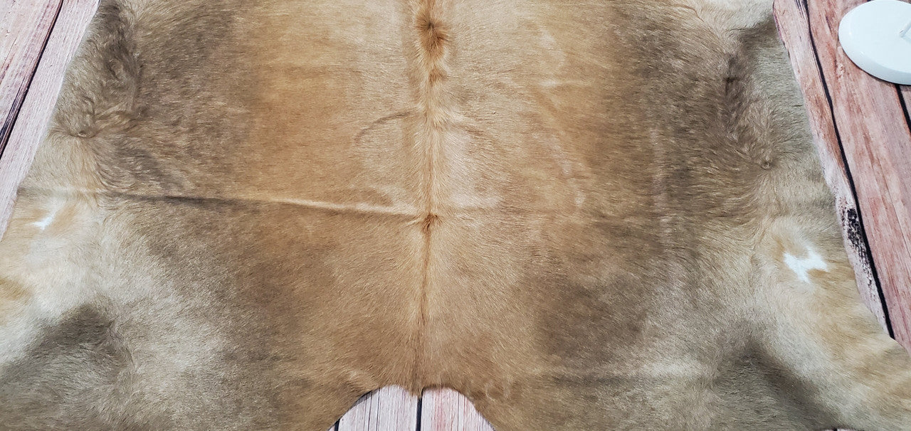 Qualité de tapis en peau de vache absolument parfaite, description, attentes tout. Je l'aime!
