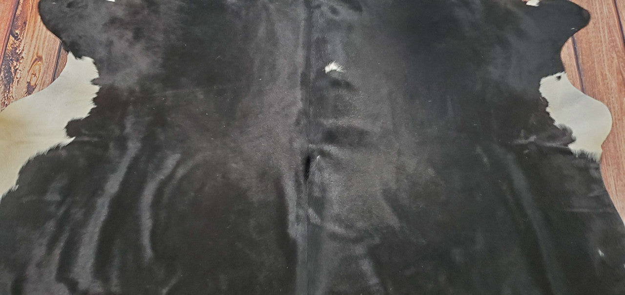 This exotic black and white cowhide rug is so much nicer than you anticipate. It's not just an ordinary rug—it's designed to make a statement in any room.