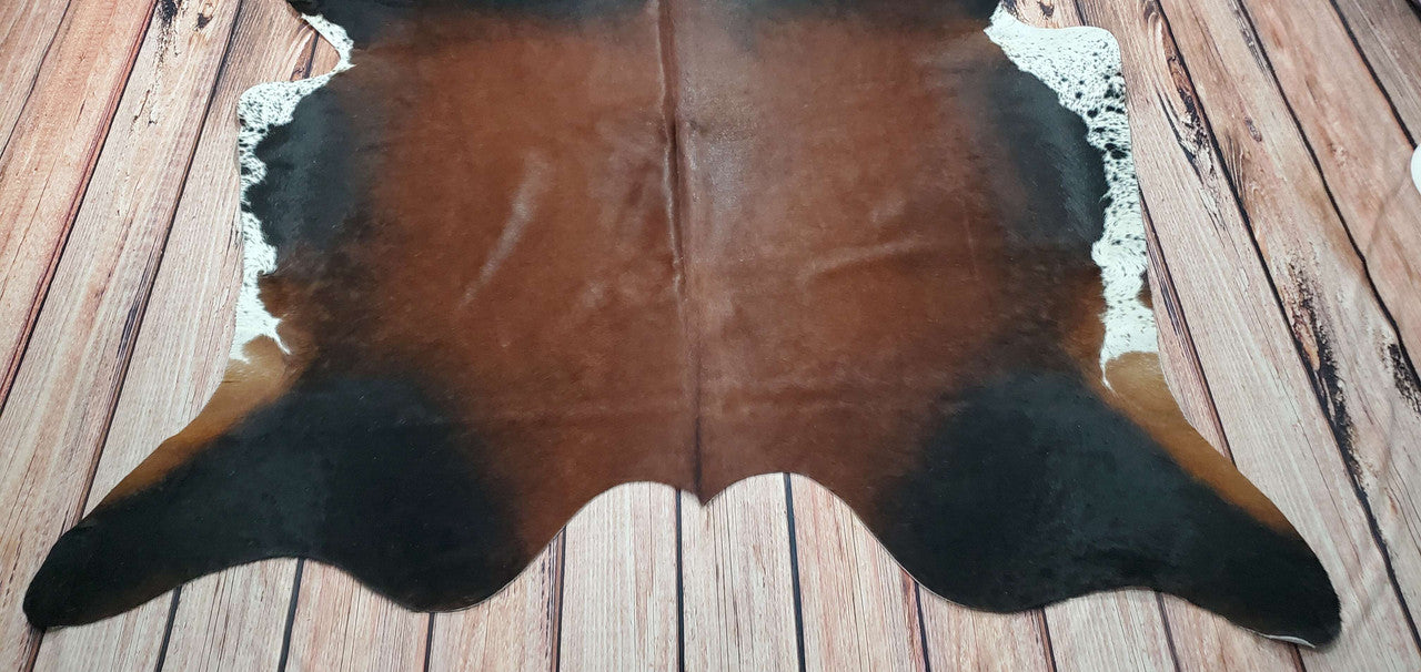 An exotic small solid brown cowhide rug can bring a touch of the outdoors inside your home. It can also help to protect your floors from dirt and scratches.
