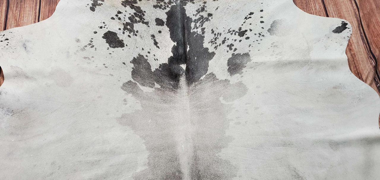 Elevate your space with our grey white cowhide rug - a luxurious blend of style and sophistication.
