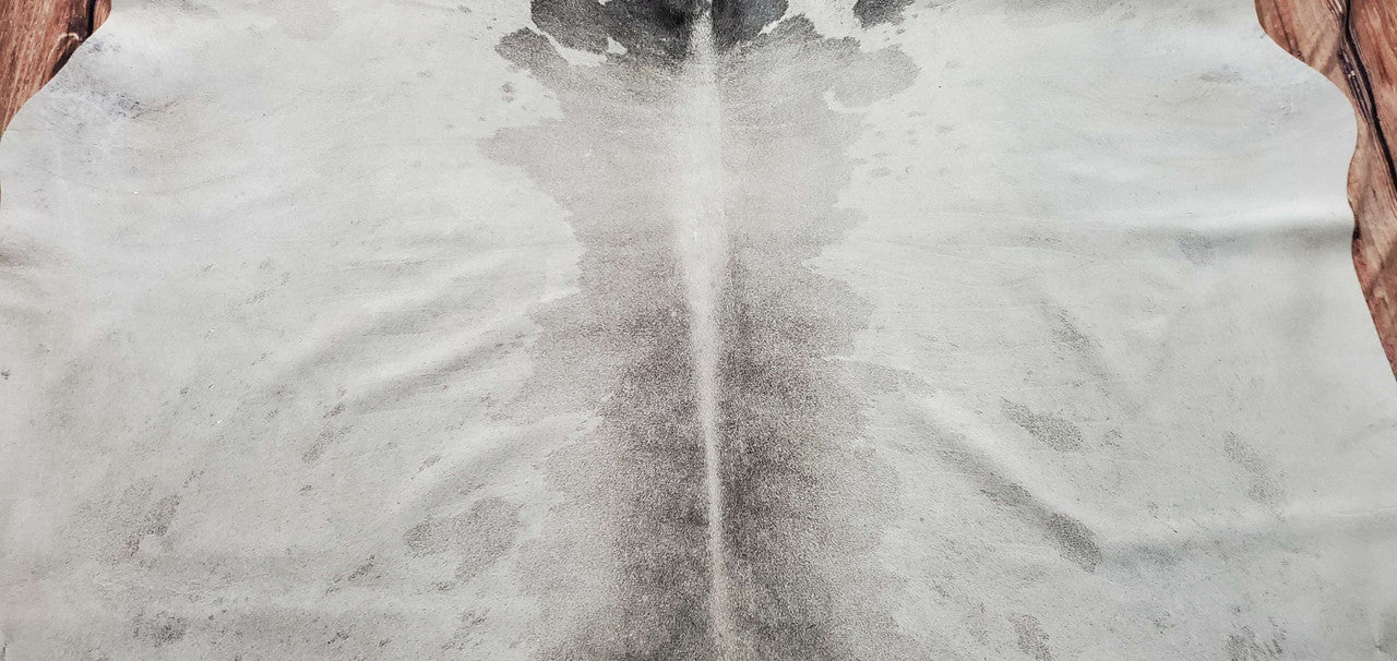 Discover the allure of our grey white cowhide rug, crafted to perfection for timeless elegance.