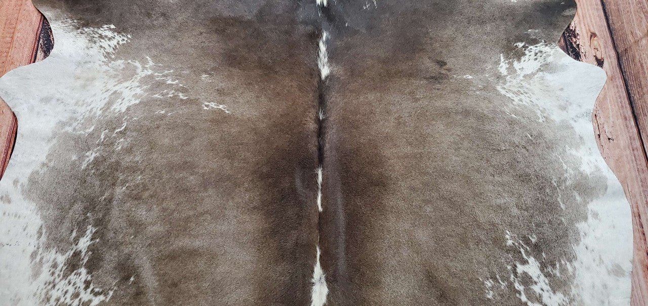 If you are planning to add cowhide rug living room, this dark brown is the best choice in Ontario