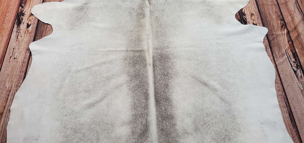This nice large taupe cowhide rug is beautiful and exactly as presented in the product photos and description, making it the perfect fit for any bedroom or living room. Fast shipping all over Canada, large size, and great for all types of pet lovers.