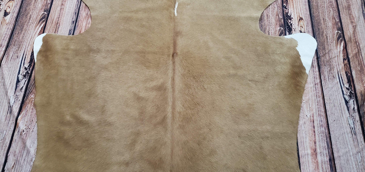 If you're looking to add a rustic western touch to your home décor, look no further than the extra small cowhide rug, it adds a unique texture and look to any room.
