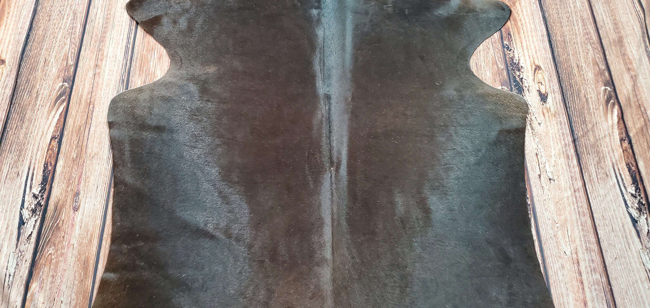 Beautiful cowhide rug, tan-black and of high quality! Great addition to our living room.