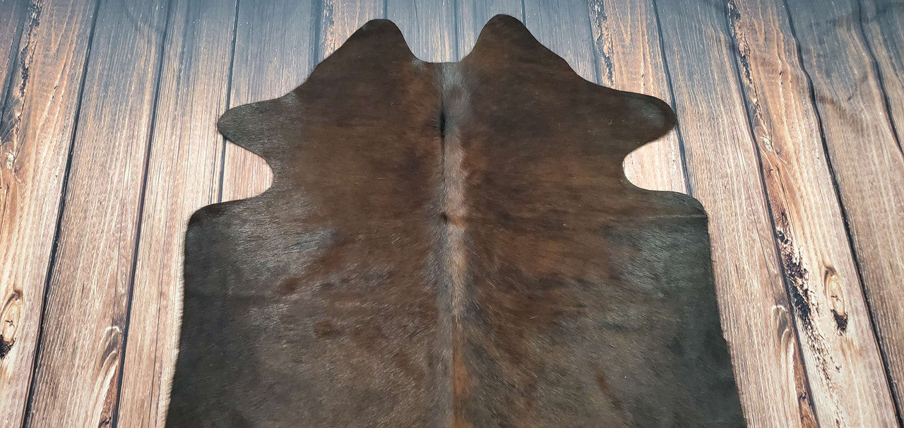 There are many different types of cowhide rugs, but one of the most popular is the dark brown variety.