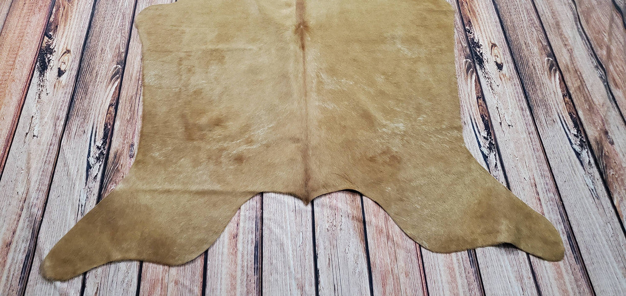 Native Brazilian cowhide rug floor covering is a perfect decision for your living room. It's strong, brown, and beige, so it will match your furnishings.