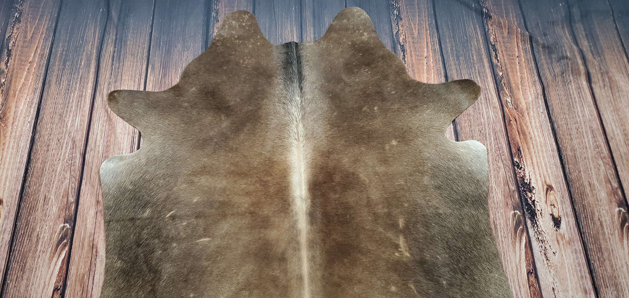 Hundreds of different different types of cowhide rugs to choose from, from dark tan to small size.