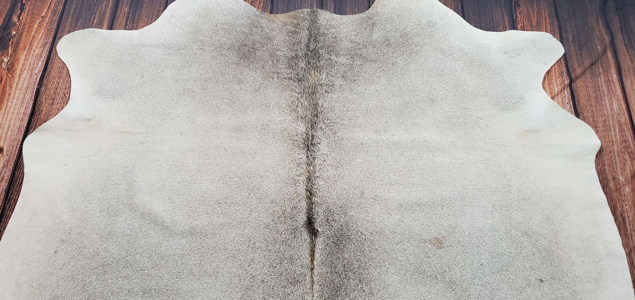 This dark gray cowhide rug boasts a distinctive, refined pattern. This is the perfect rug for your truck cabin or Tundra interior plus its free delivery all over Canada