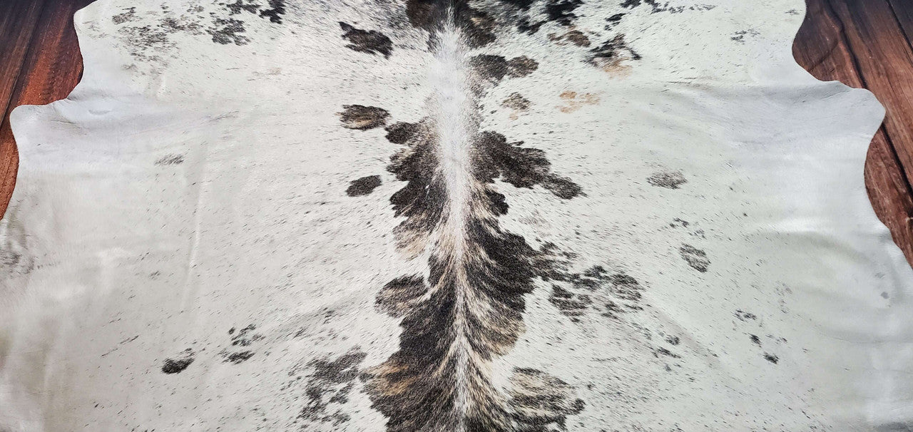 Add a touch of rustic elegance to your home with our brindle cowhide rug. Perfect for complementing any interior design style.