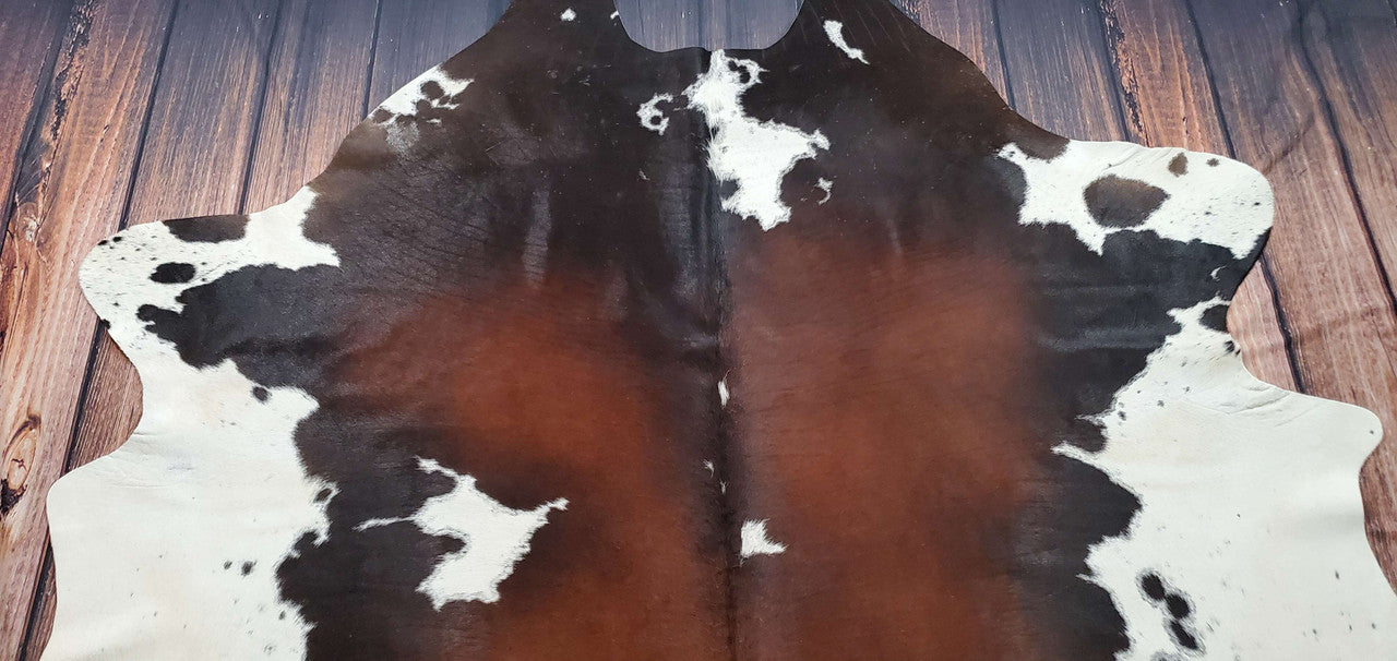 A dark-brown spotted cowhide rug can do wonders for your home, transforming it into a cozy space and anywhere in Canada in one to four days.