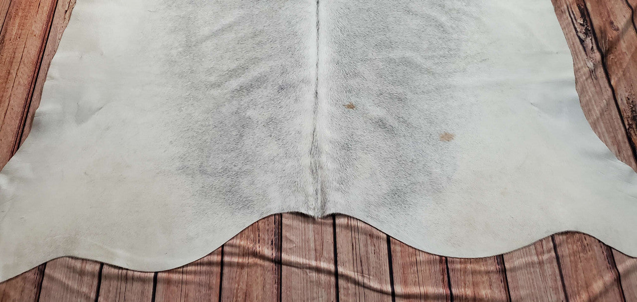 A new grey cowhide rug with a leather sectional is a big pay off, decorate a new living room.