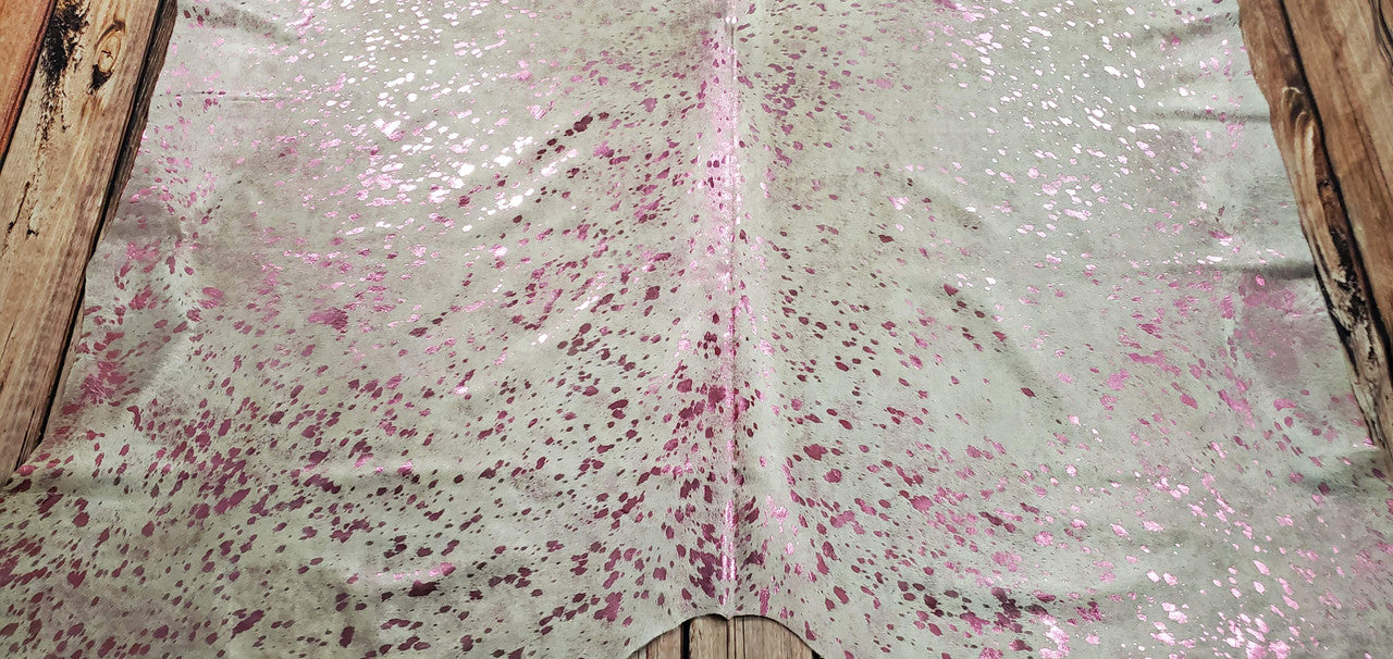 The hair on cow hide rugs are perfect to use metallic cowhide fabric. These are pink metallic washed on white cowhide.