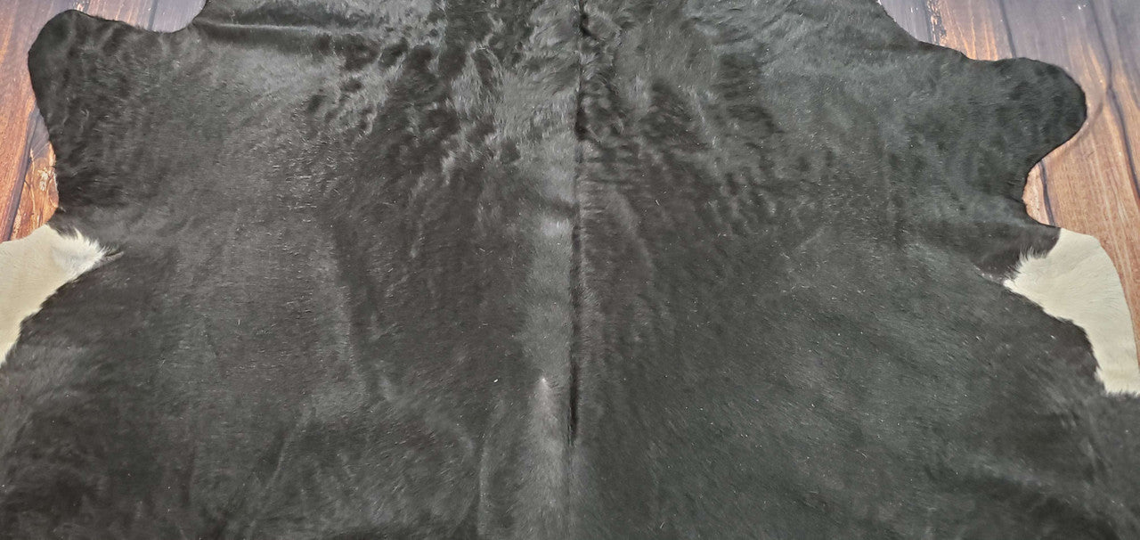 This large cowhide rug is picked out specifically for its natural pattern, with absolutely no upsetting softness, and very lovely to touch. This cowhide looks great for living rooms, and it will add a touch of class to your space.