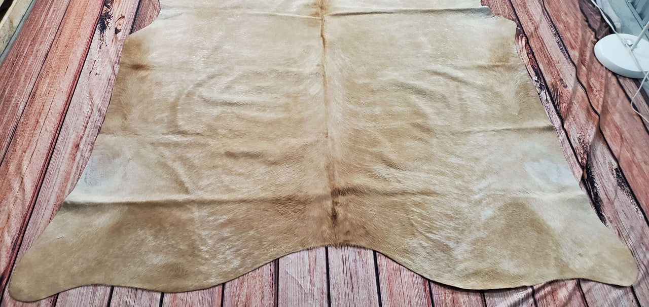 This unique cowhide rug in natural beige will give the feel of uniform proportions to any home decor. Our cowhides are made using the softest of materials and have unique appearances and patterns.