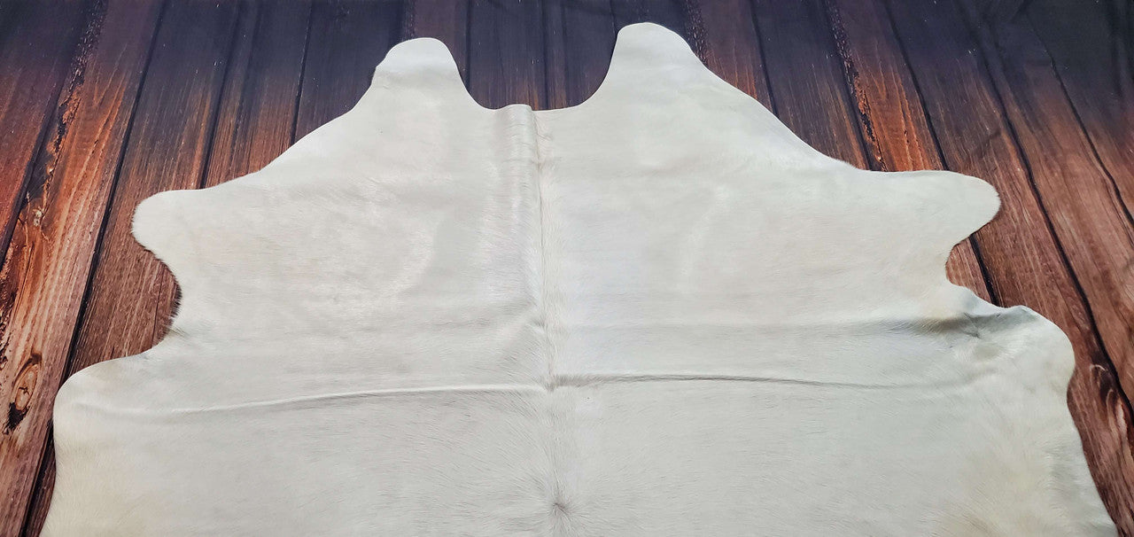 This amazing cream cowhide rug is quite beautiful. Plush and lively, it can embellish a nursery.
