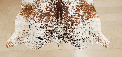 An extra small cowhide rug adds sophistication to the living room or home office, easy to pair with almost any other jute rug, best cowhides in Canada