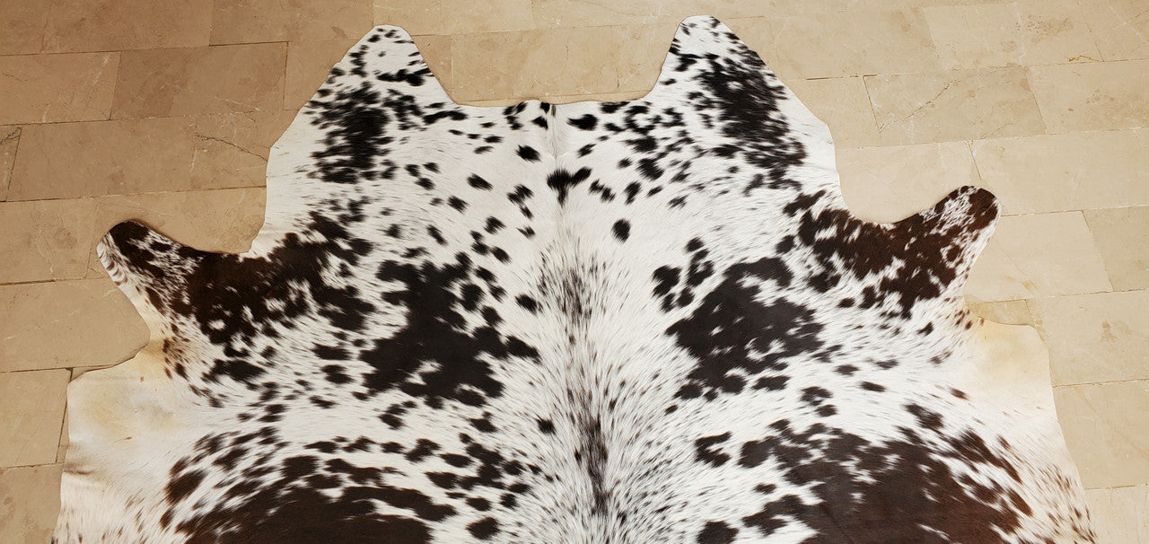 An extra small cowhide rug is a perfect way to add a touch of luxury to your home. These rugs are mostly beige with stripes and are hand finished to perfection