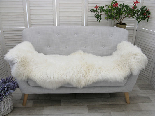 Elevate your space with the luxurious softness of a genuine sheepskin rug. Add warmth and elegance to any room with this natural accent.