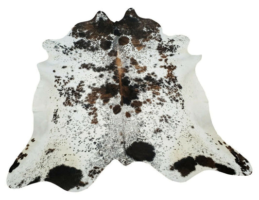 A large, natural, real speckled cowhide rug is the perfect way to add a touch of rustic elegance to your home. 