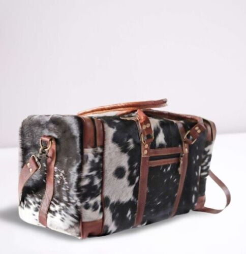 This is a unique way to travel in style. Patchwork cowhide duffle bag from handmade patchwork cowhides makes for great traveling. A tricolor arrangement of leather patches is sewn and attached together to create this work of art.