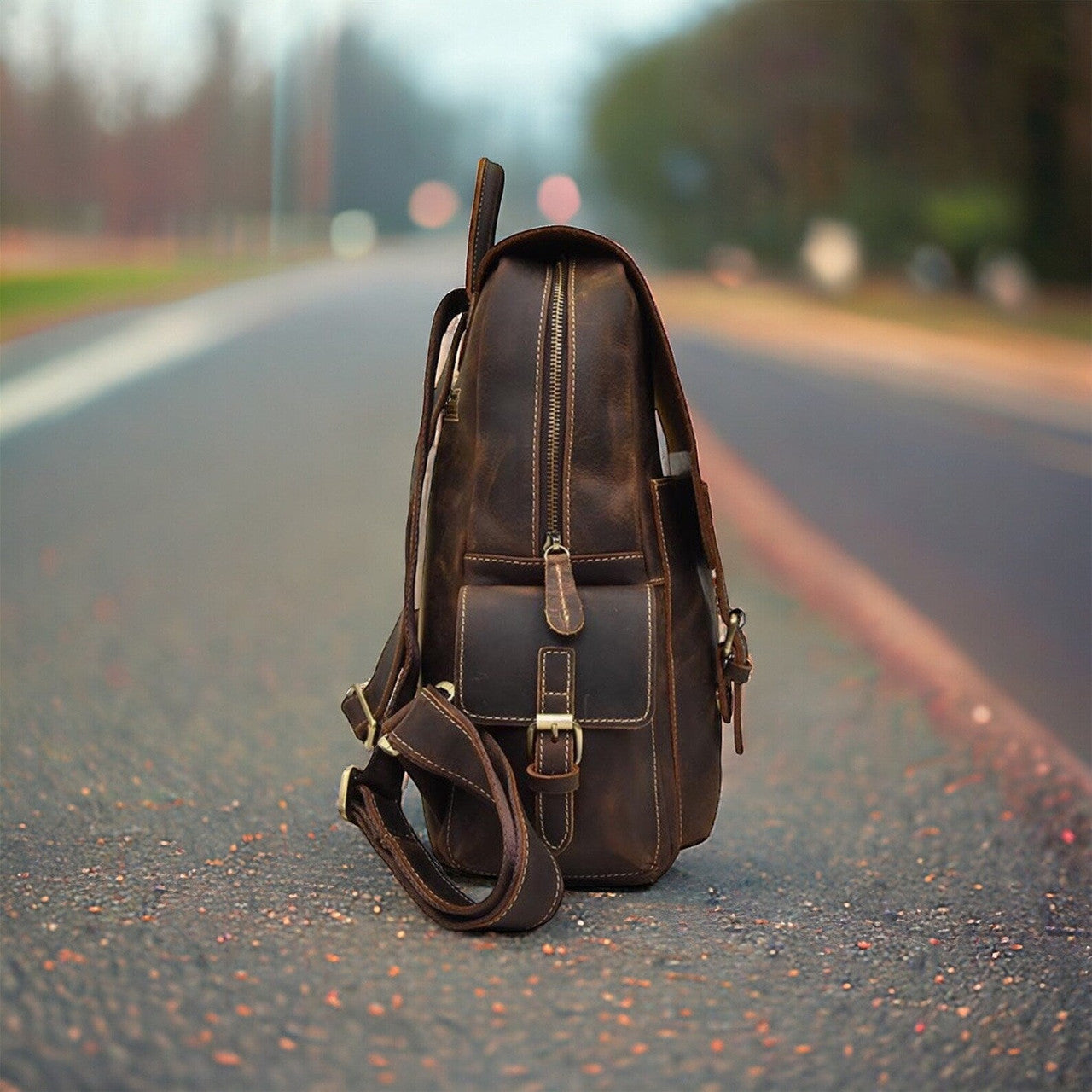 A detailed photograph of a high-quality leather backpack, highlighting its impeccable craftsmanship and attention to detail. Intricate hand-stitched seams and reinforced leather panels demonstrate the artisanal skill involved in its construction, while the smooth, matte finish exudes refinement. The backpack's ergonomic design and padded straps suggest comfort and functionality for all-day wear.