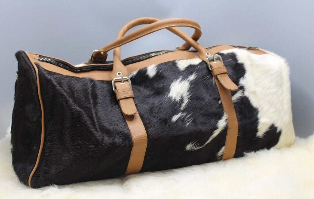 The cowhide luggage bag is the perfect companion for any traveler. It’s stylish, durable and has plenty of room to store all your belongings. Made from genuine leather, this bag is designed to keep its shape and color even after years of use.
