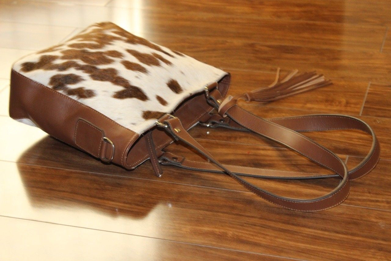 Nicely made cowhide messenger bag finished is very soft, smooth and real leather and it will serve you for a long time, also available custom fur purses