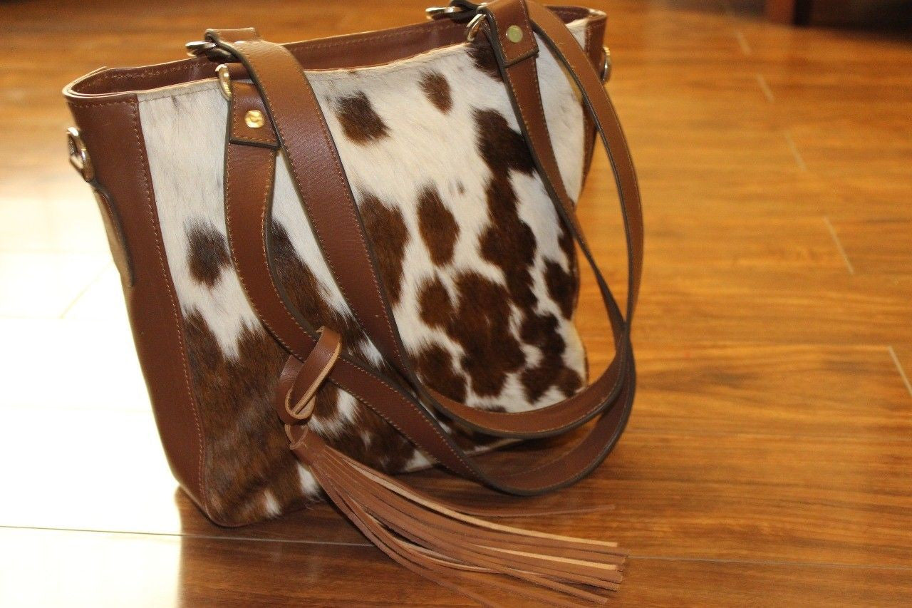 Real cowhide bag Canada made from real and soft brown white spotted pattern.