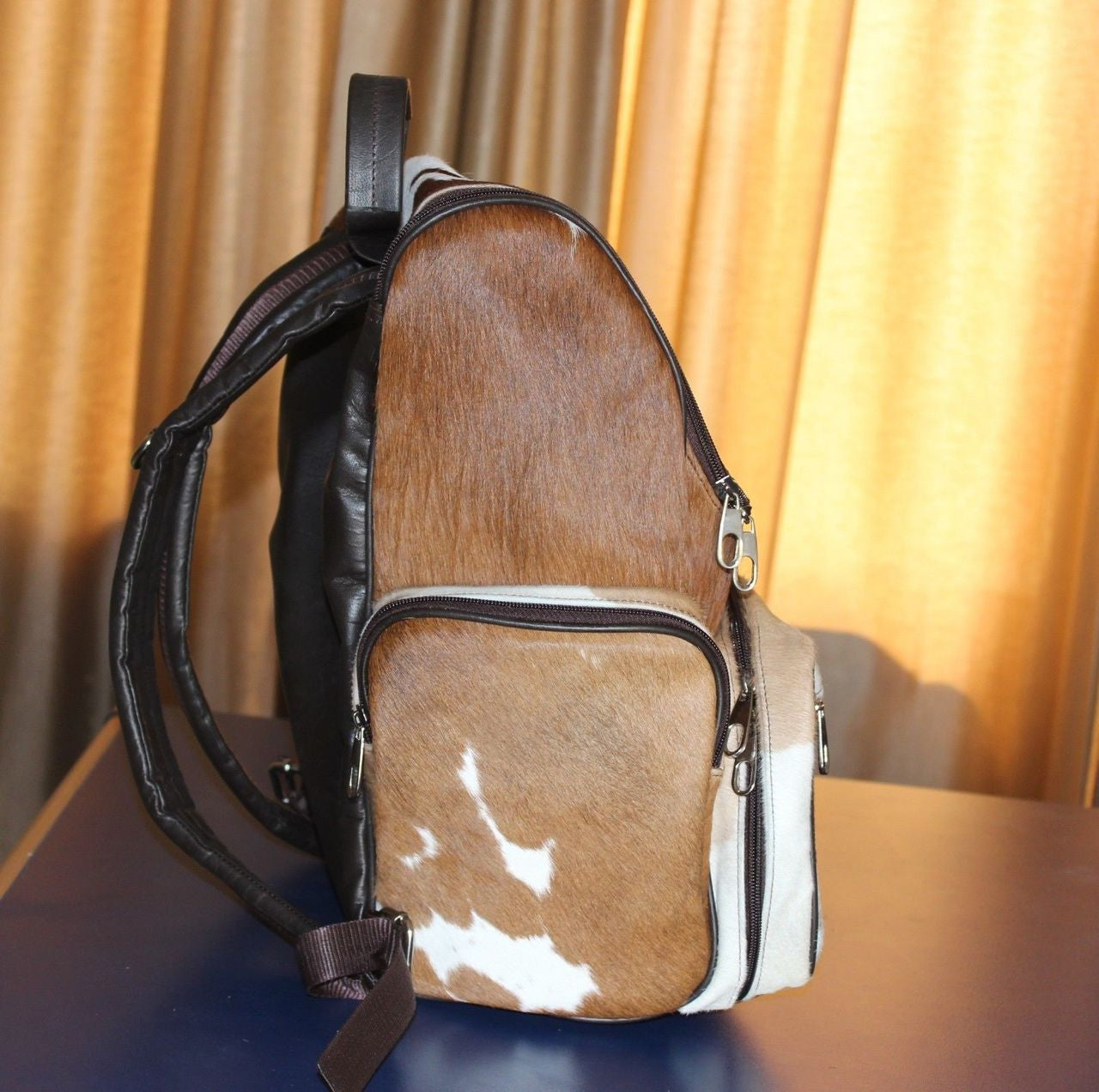 Searching for cowhide diaper bag.