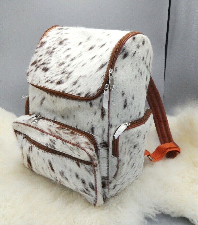 Stay fashionable with our custom cowhide backpack for your daily outings, perfect for handsfree use, fits your macbook air and pro.