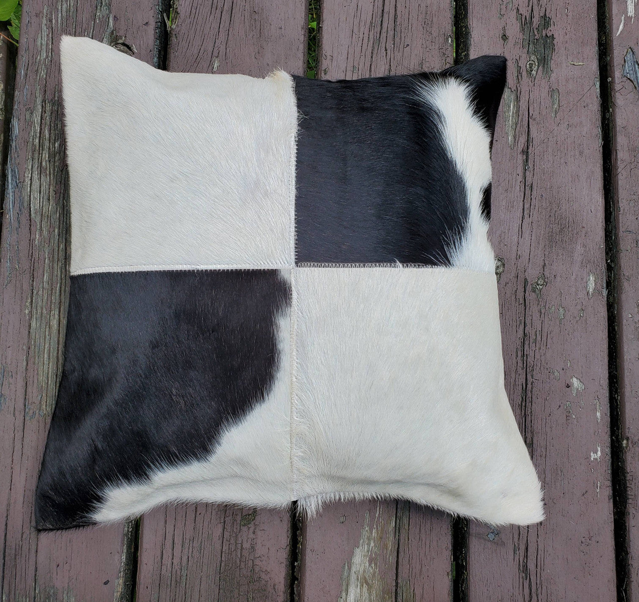 The cowhide square pillow covers arrives fast and are just perfect. these really ground the whole room decor grouping together