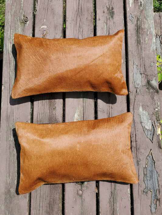 Loving this natural gorgeous cowhide lumbar pillow cover ! Looks even better in person, this will complete a mancave easily