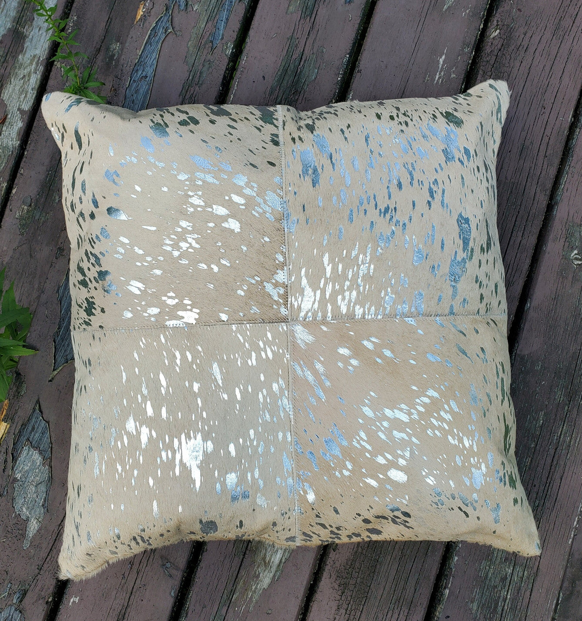 A stunning custom made extra large metallic gold cowhide cushion covers which will work in any ranch room.
