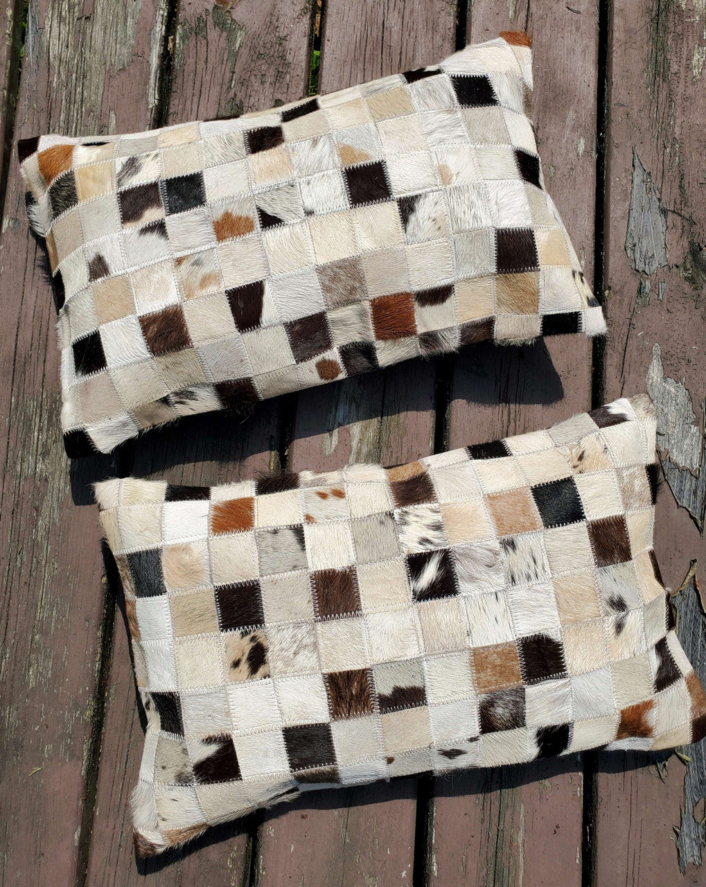 Fantastic cowhide pillow in lumbar style to work with, the thread and natural patchwork fabric is a wonderful spice to the decor.
